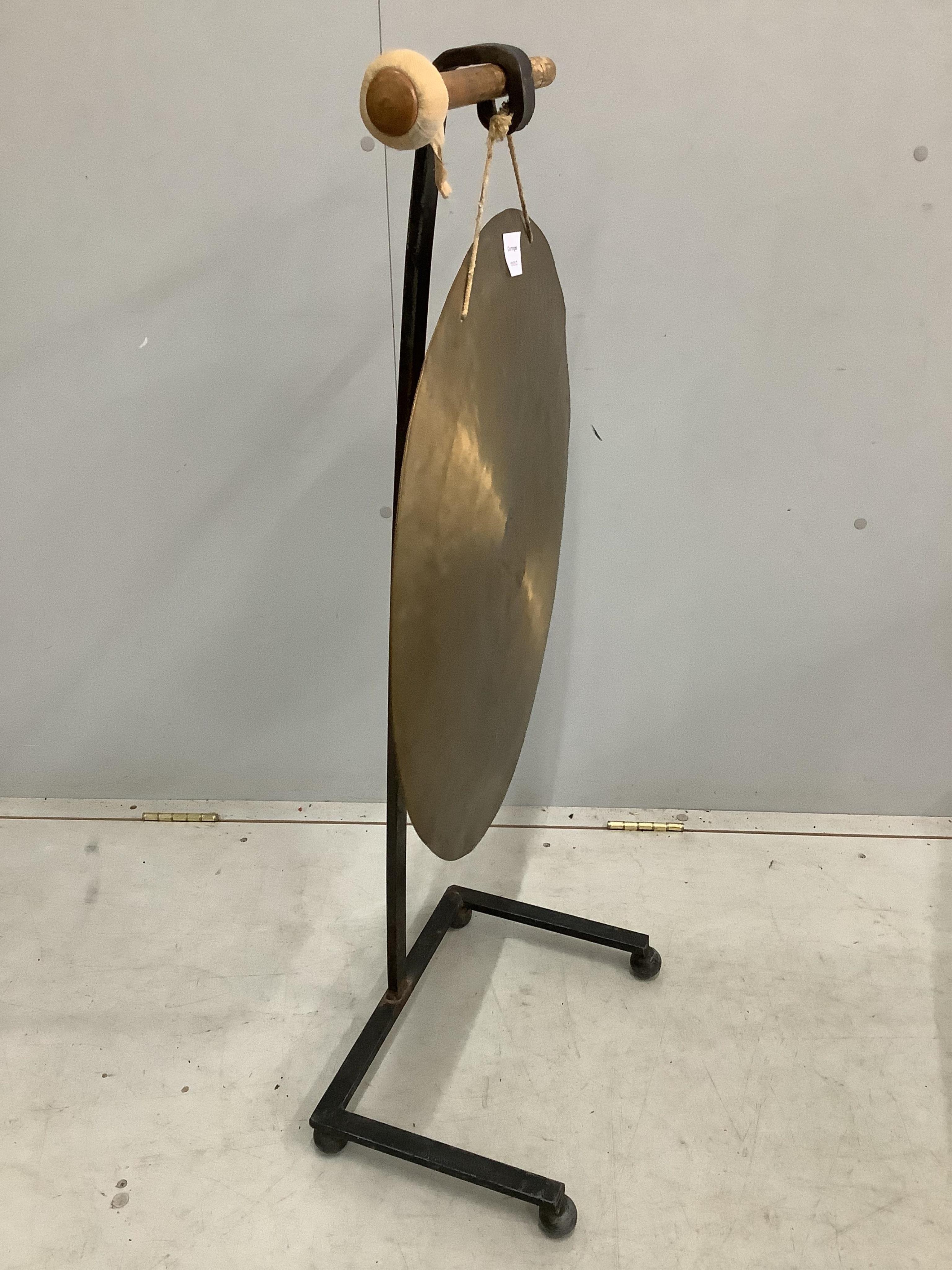 A Chinese gong on wrought iron stand, height 102cm